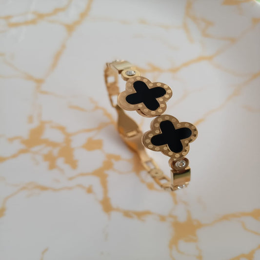 Golden black clover anti tarnish kada. Sleek design with front open.