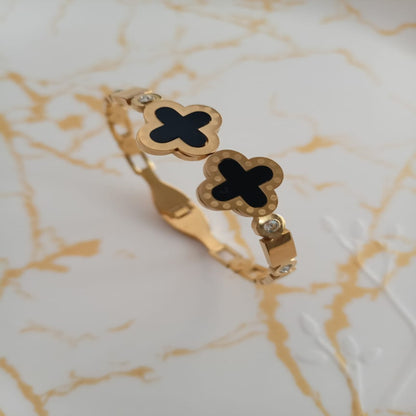 Golden black clover anti tarnish kada. Sleek design with front open.