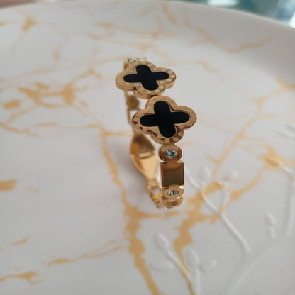 Golden black clover anti tarnish kada. Sleek design with front open.